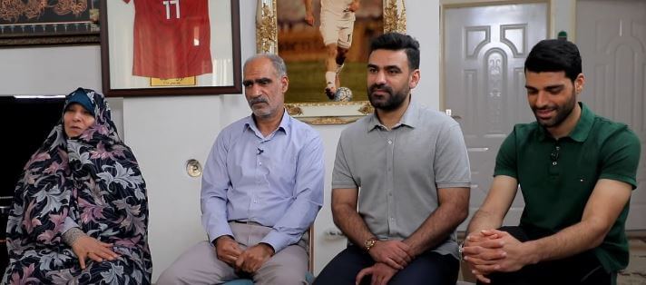 Mehdi Taremi with his parents and elder brother Mohammad.
